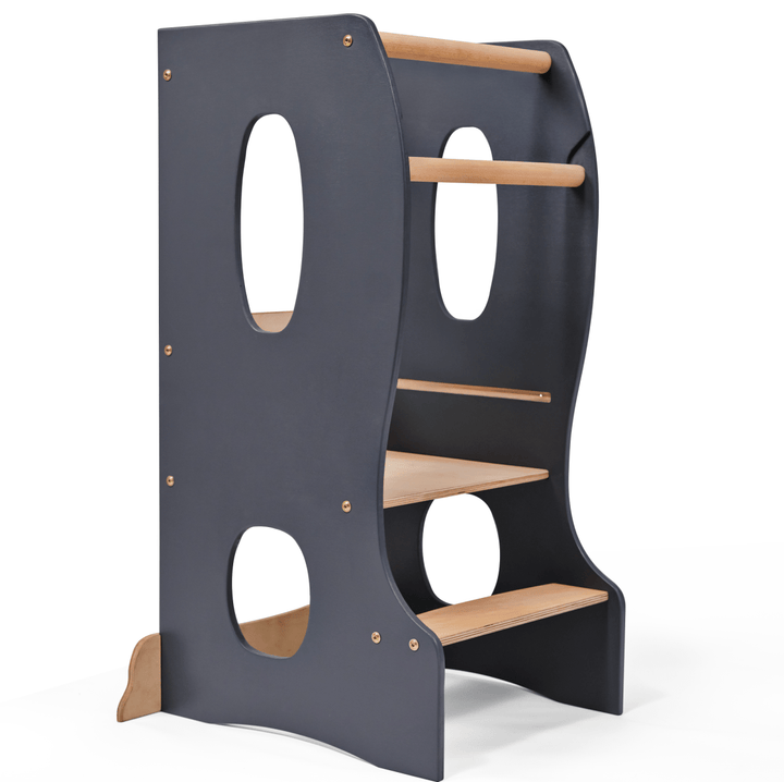 A gray Montessori tower with wooden elements and cut-out handles, designed to be stable and adjustable for children.